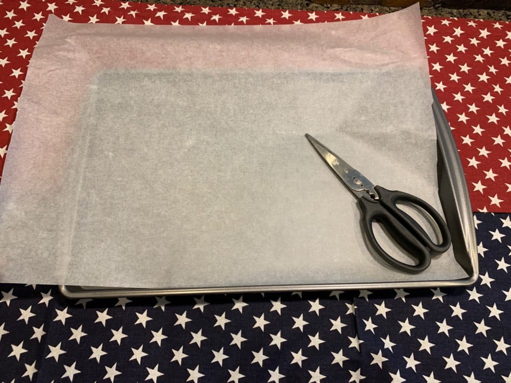 Parchment paper on pan for flag fruit pizza