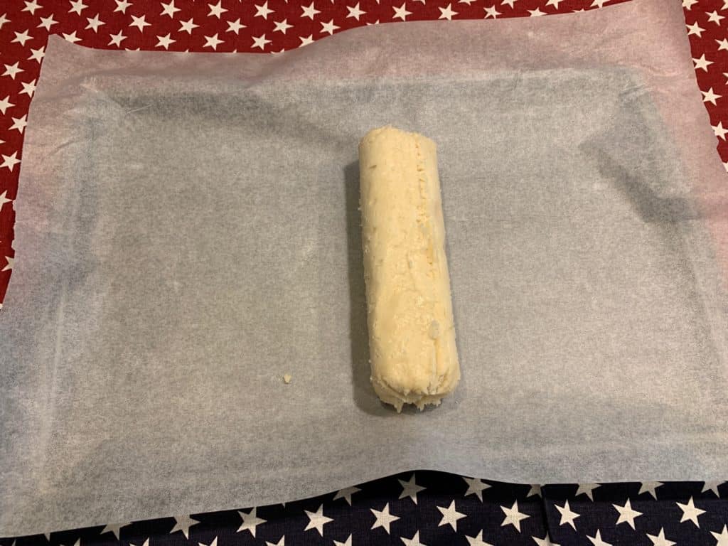 cookie dough on pan, ready to roll for flag fruit pizza