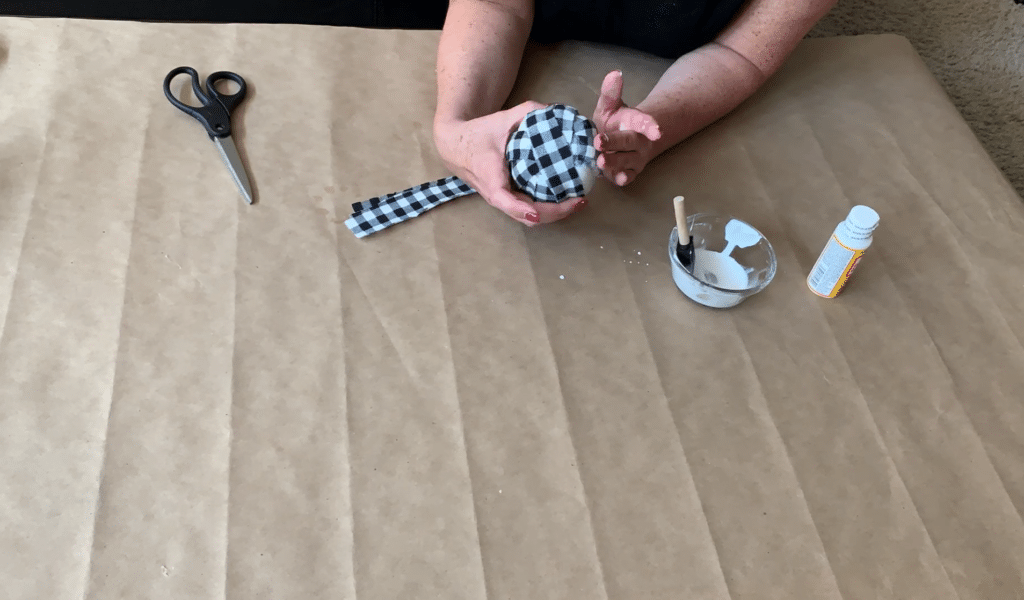 Covering foam pumpkin with fabric strips