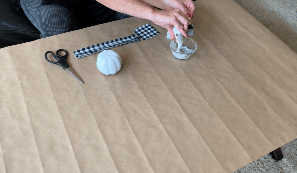 Pouring Mod Podge into bowl