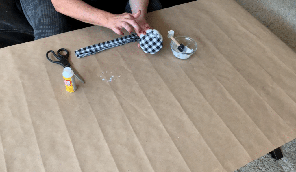 Covering foam pumpkin with fabric strips