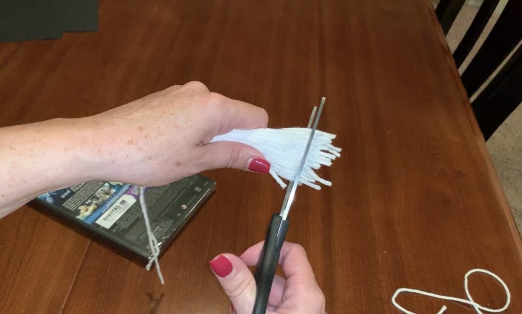 Trimming the tassel to make ghost tassel garland