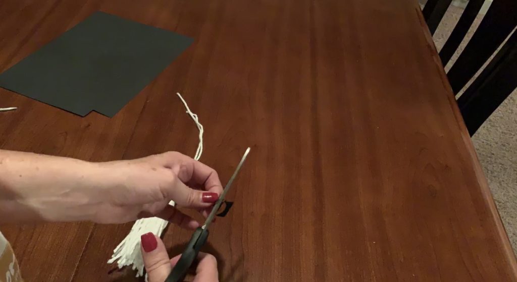 Cutting eyes for Halloween ghost garland