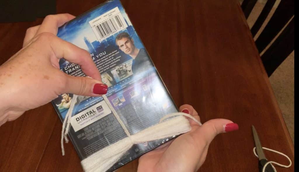 Remove the yarn from the template to make your yarn tassel for the ghost garland