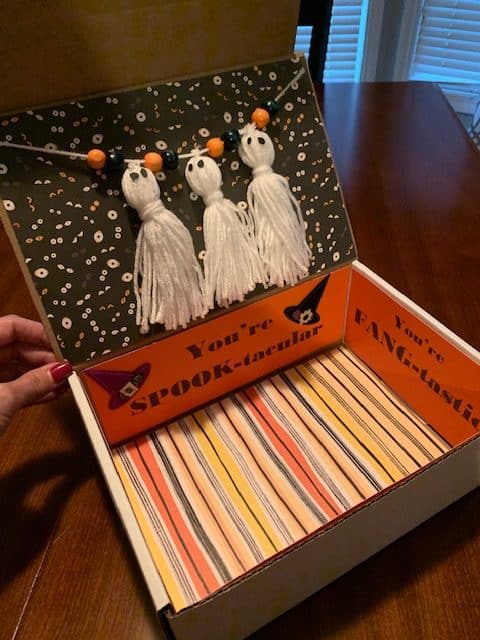 ghost tassel garland on a Halloween care package