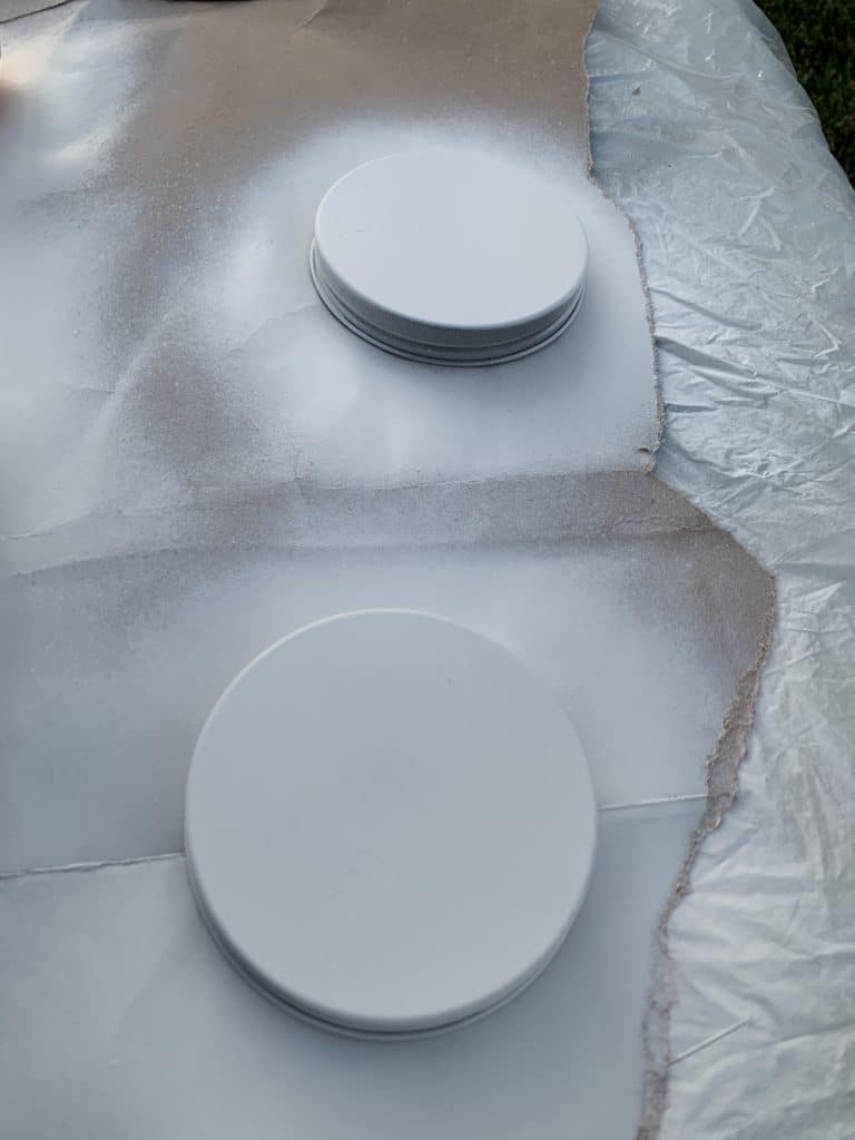 Painting jar lids of $1 jars from Dollar Tree