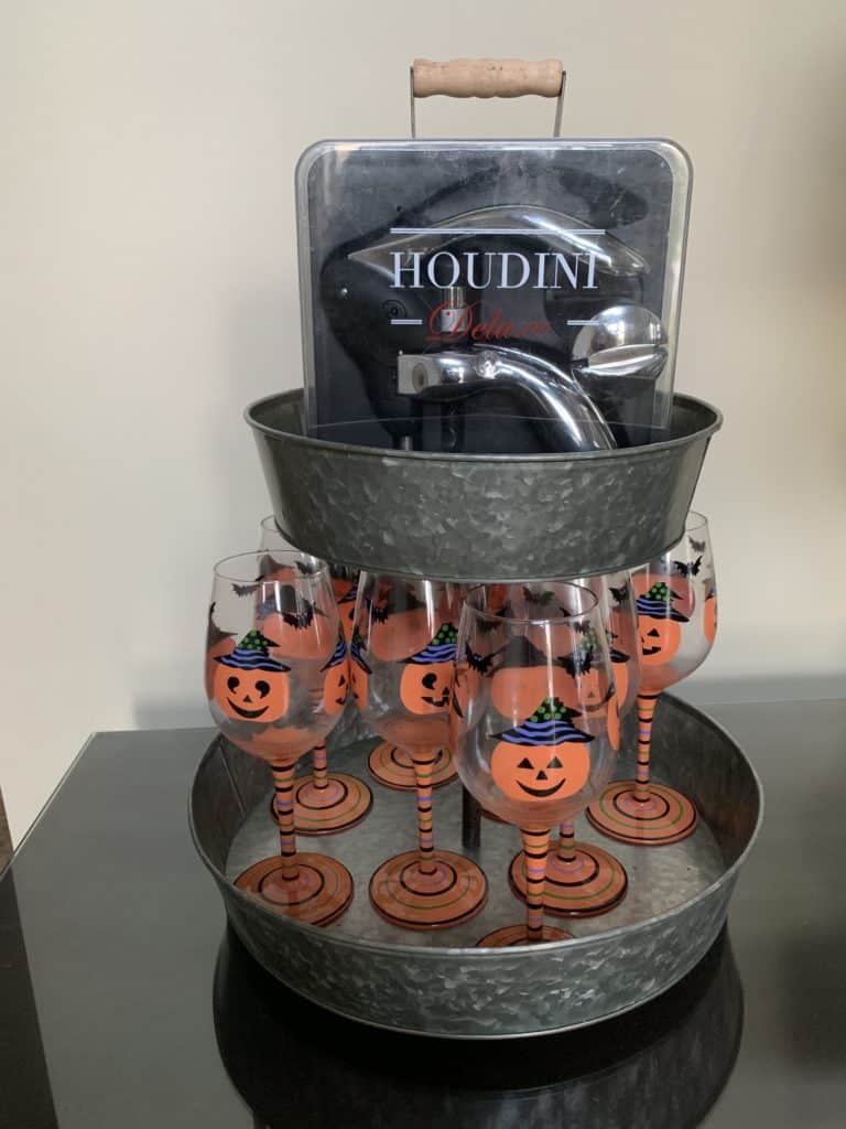 Halloween wine glasses and wine opener on tiered tray