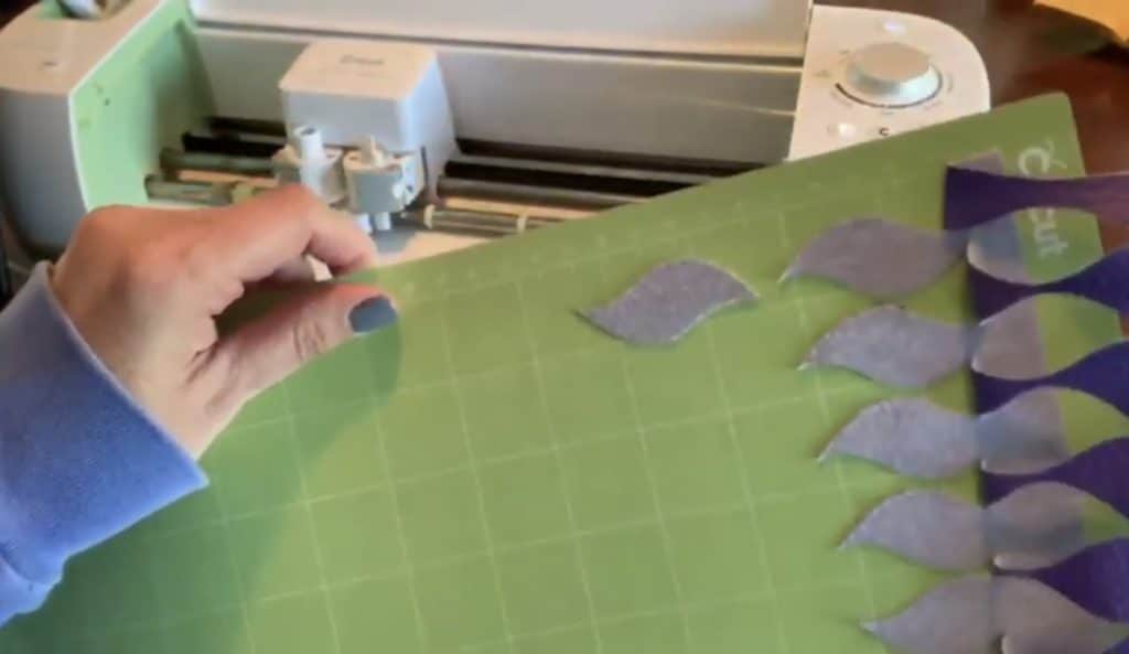 making diy faux leather earrings on cricut machine