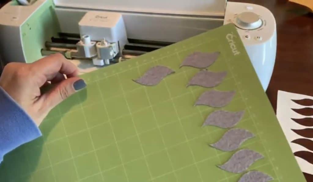 making diy faux leather earrings on cricut machine