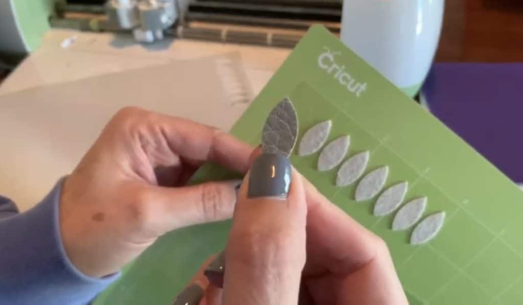 making diy faux leather earrings on cricut machine