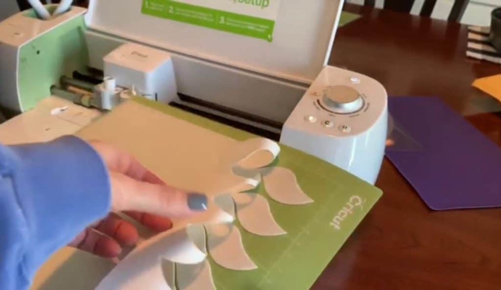 making diy faux leather earrings on cricut machine