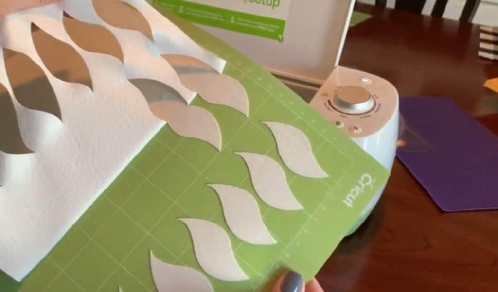 making diy faux leather earrings on cricut machine