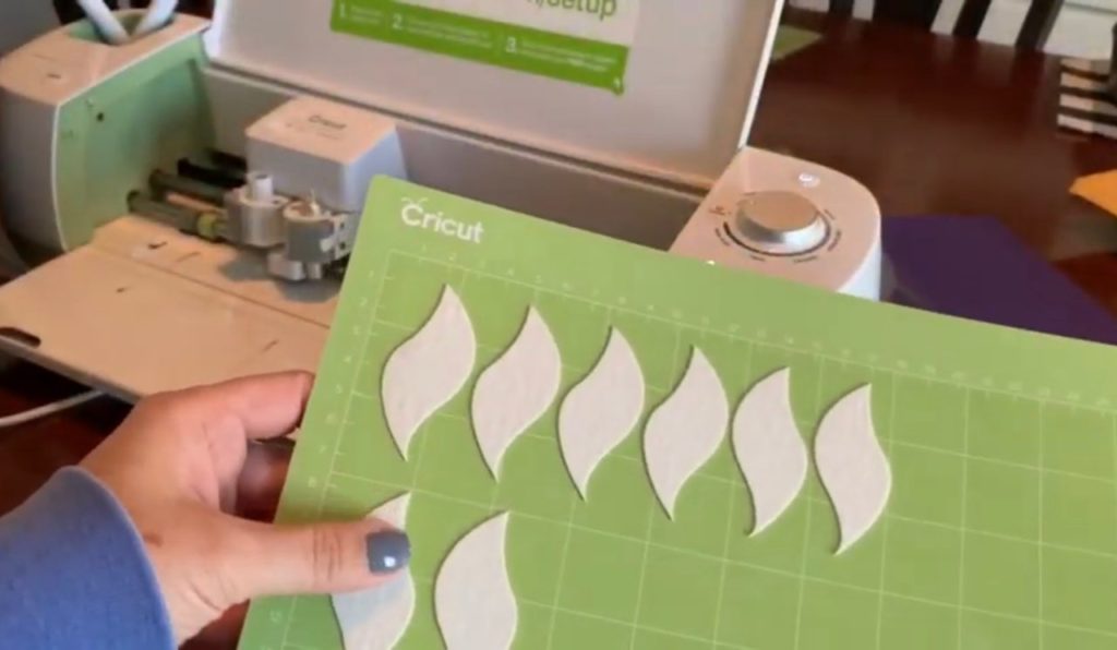 making diy faux leather earrings on cricut machine
