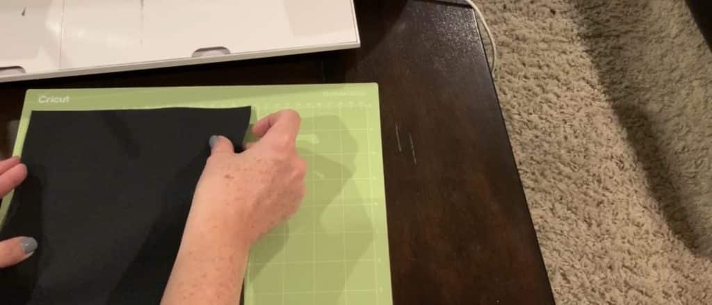 placing faux leather onto Cricut mat