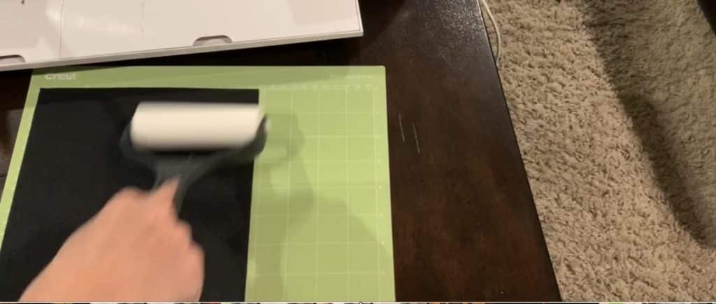 placing faux leather onto Cricut mat
