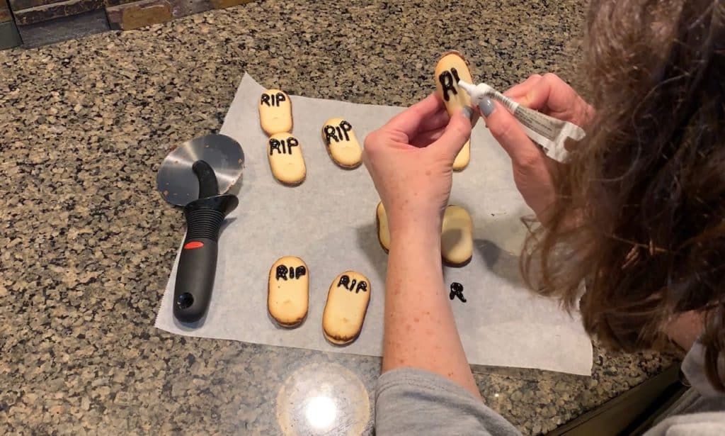 writing RIP on Milano cookies
