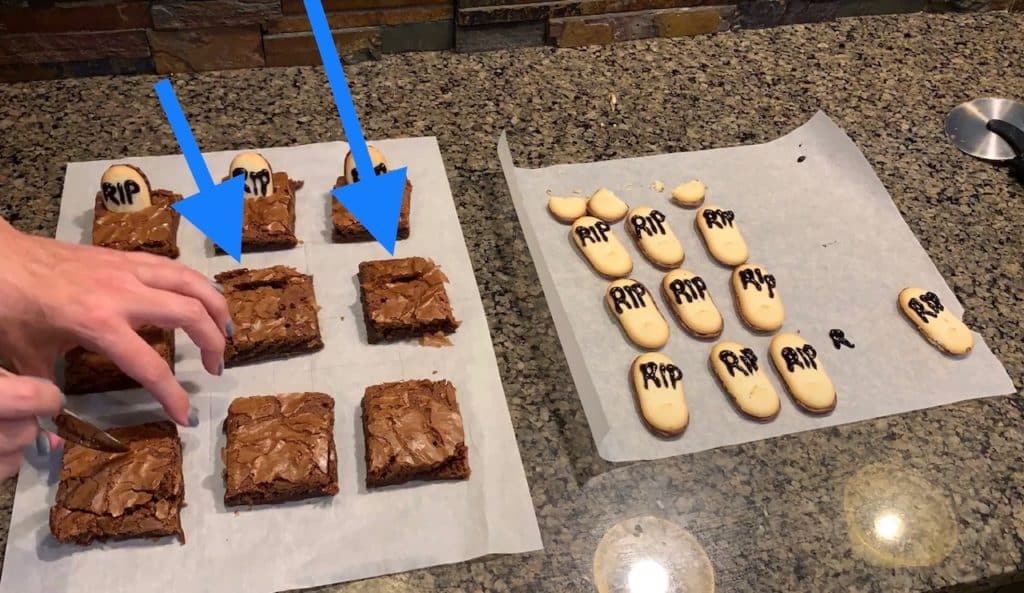 slits in the brownies and inserting tombstones