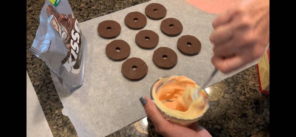 stirring frosting for melting witch brownies