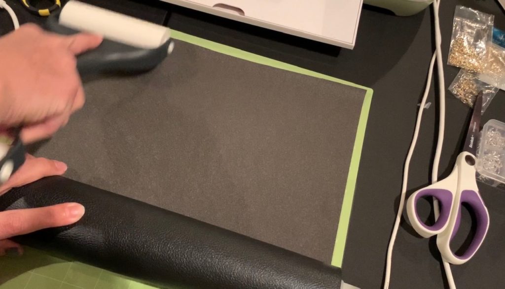 rolling faux leather onto Cricut mat