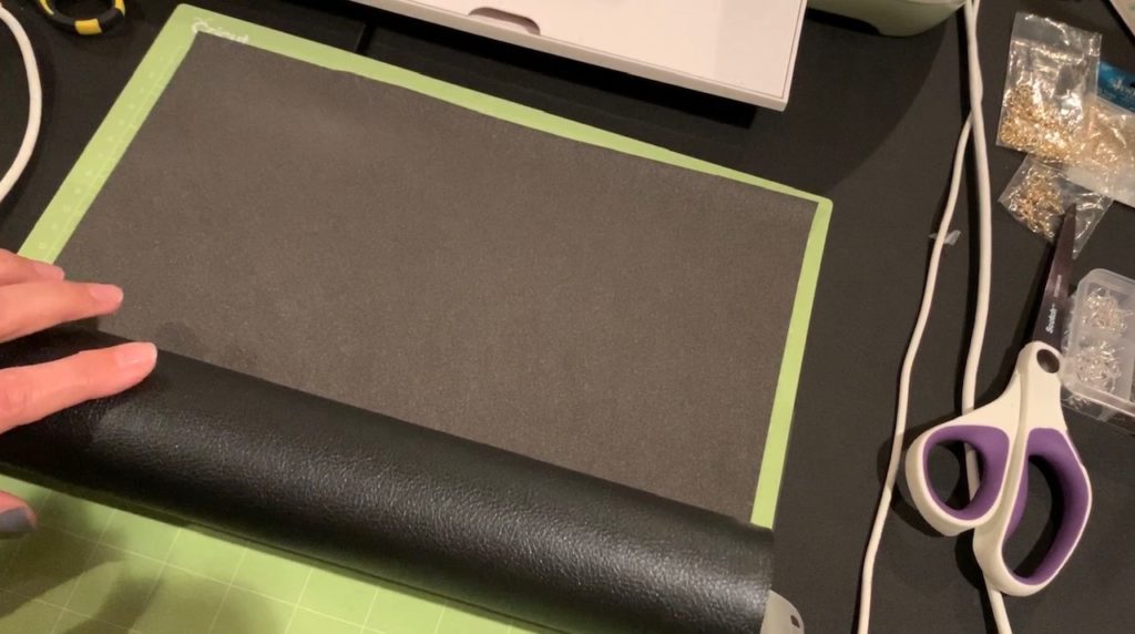 putting faux leather onto Cricut mat