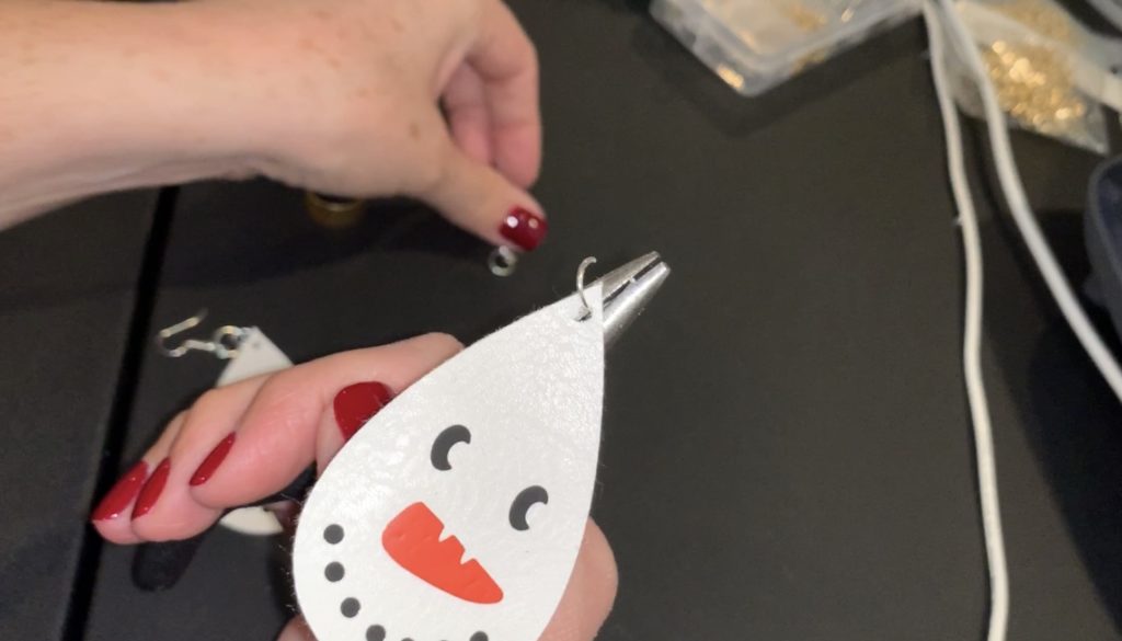 putting together snowman faux leather earring