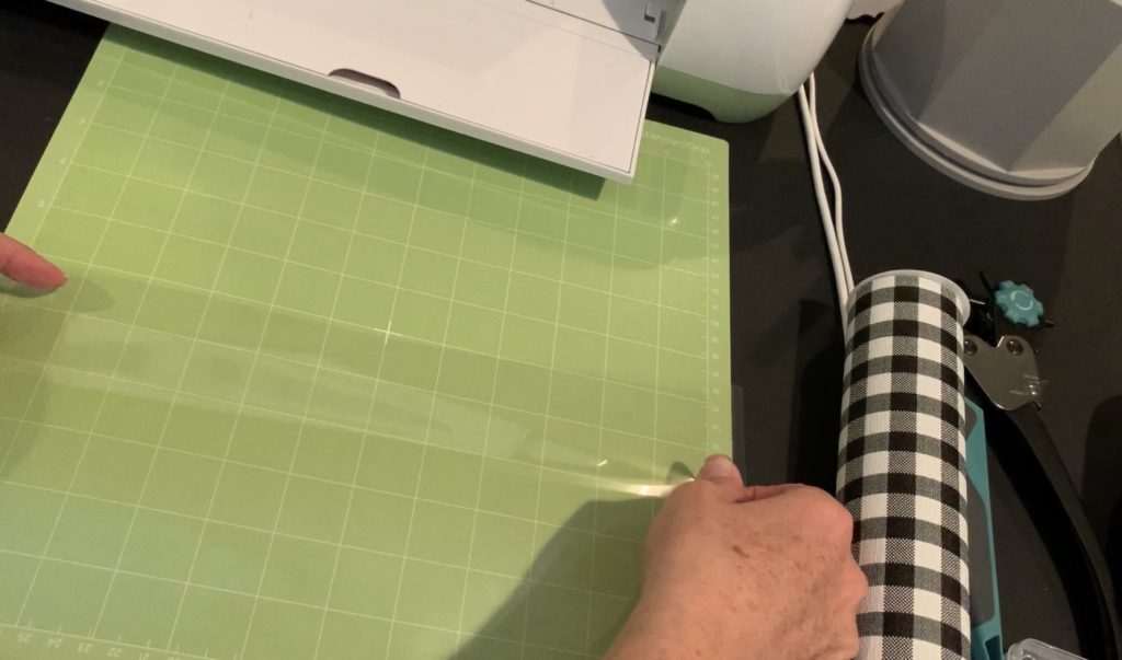 Making snowman faux leather earrings on the cricut machine