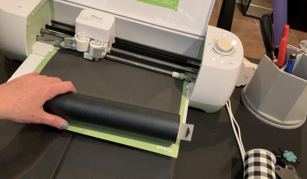 Making snowman faux leather earrings on the cricut machine