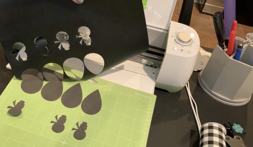 Making snowman faux leather earrings on the cricut machine