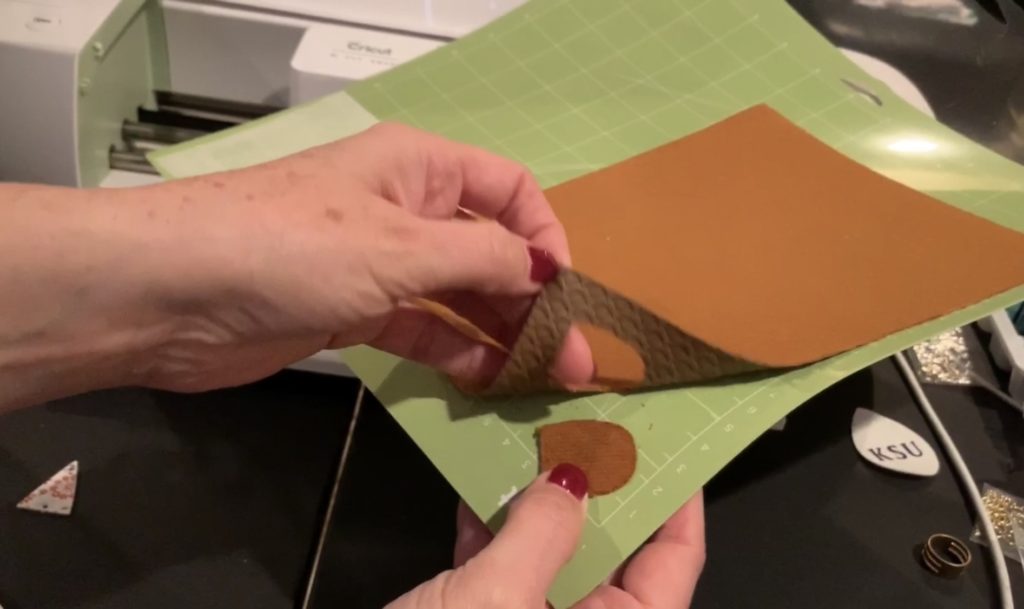 cut faux leather on the Cricut mat