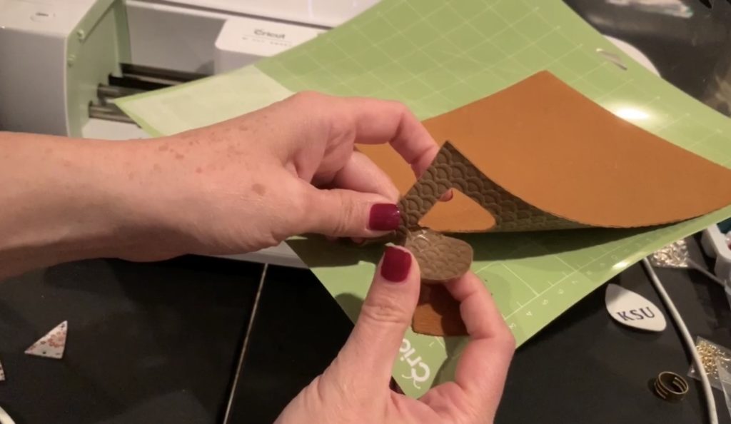 cut faux leather on the Cricut mat