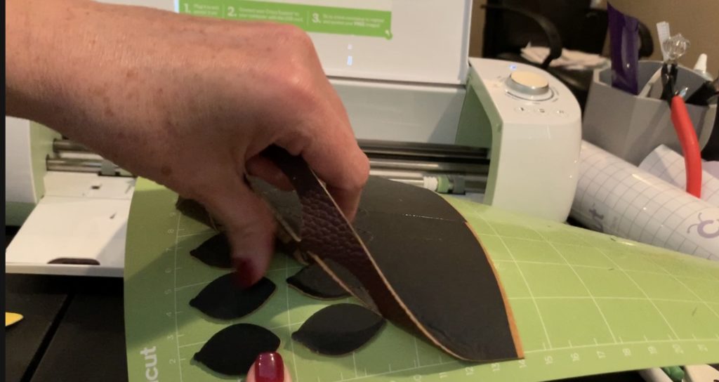 football faux leather earring pieces cut with Cricut Explore