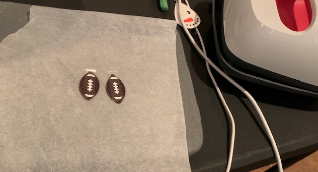 ironing football markings onto football faux leather earrings