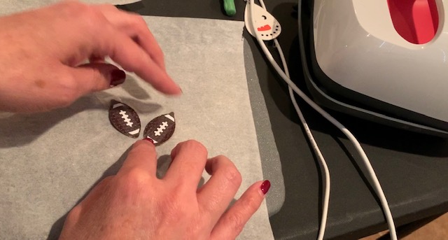 ironing football markings onto football faux leather earrings