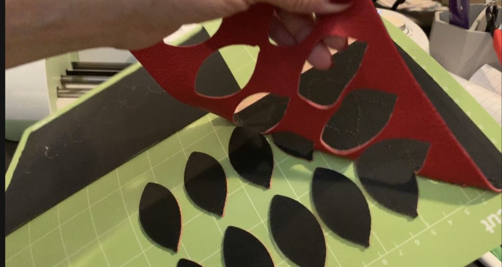 football faux leather earring pieces cut with Cricut Explore