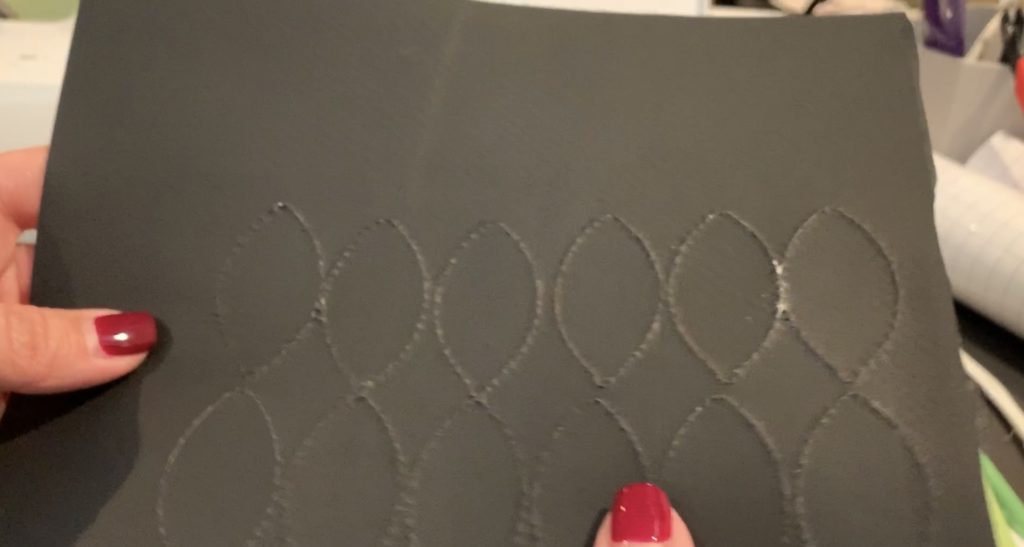 football faux leather earring pieces cut with Cricut Explore