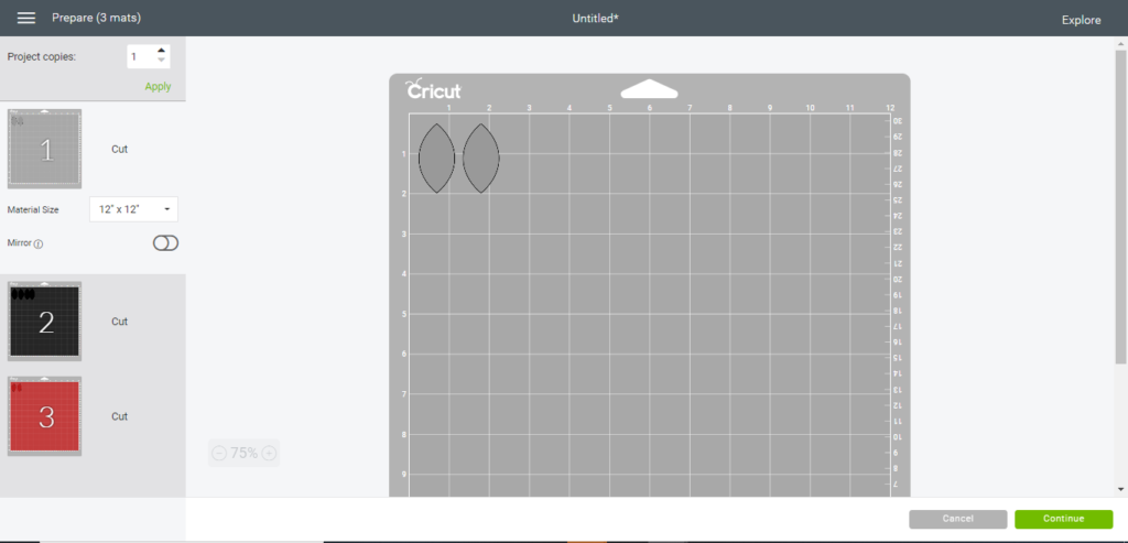 diy faux leather earrings on the cutting mat, ready to cut