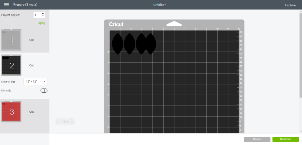 diy faux leather earrings on the cutting mat, ready to cut