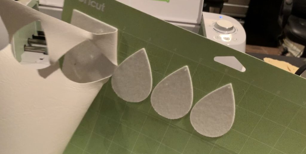 making snowflake faux leather earrings on the Cricut machine