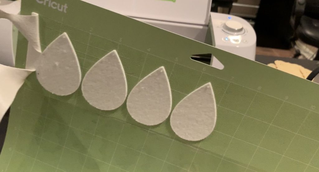 making snowflake faux leather earrings on the Cricut machine