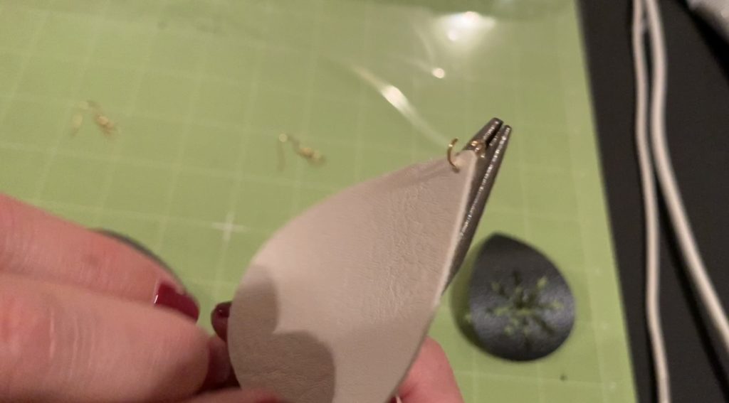 making snowflake faux leather earrings on the Cricut machine