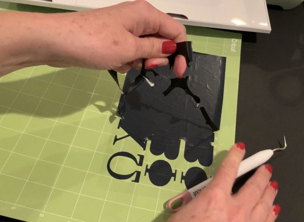 black heat transfer vinyl cut and ready to apply with a Cricut Easy Press