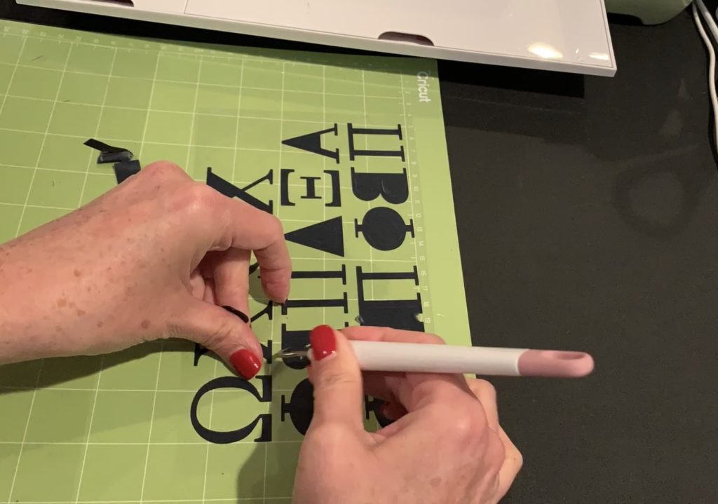 black heat transfer vinyl cut and ready to apply with a Cricut Easy Press