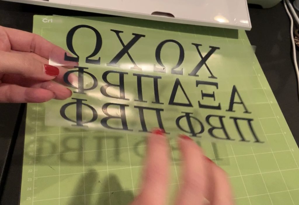 black heat transfer vinyl cut and ready to apply with a Cricut Easy Press