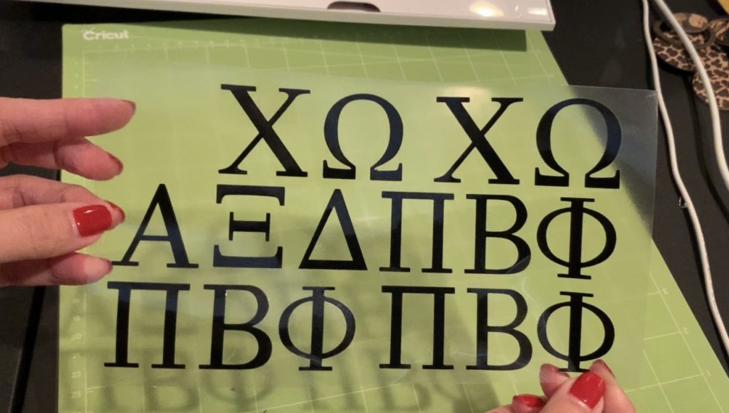 black heat transfer vinyl cut and ready to apply with a Cricut Easy Press