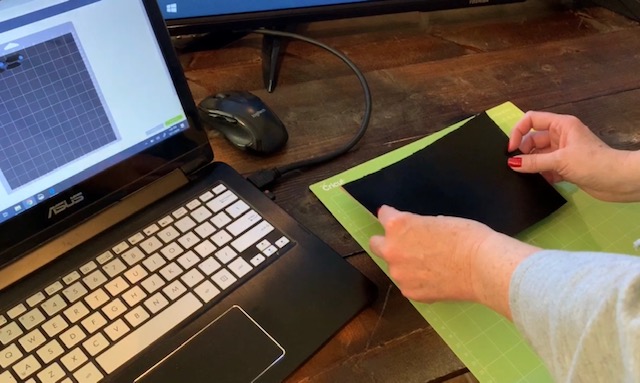 putting cork sheet onto green cutting mat