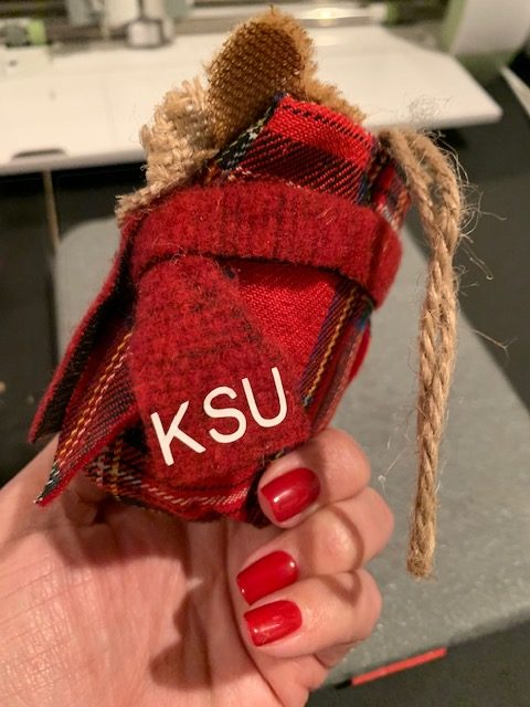 Personalize with Cricut by using heat transfer vinyl to put letters on these owl ornaments