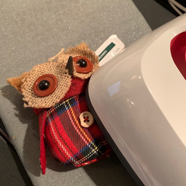 Personalize with Cricut by using heat transfer vinyl to put letters on these owl ornaments