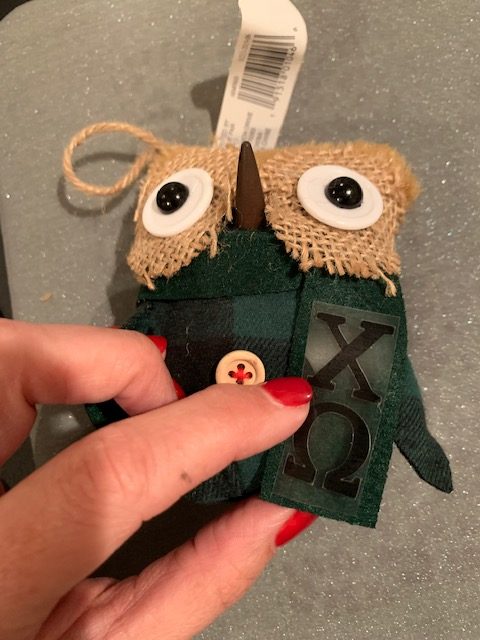 Personalize with Cricut by using heat transfer vinyl to put letters on these owl ornaments