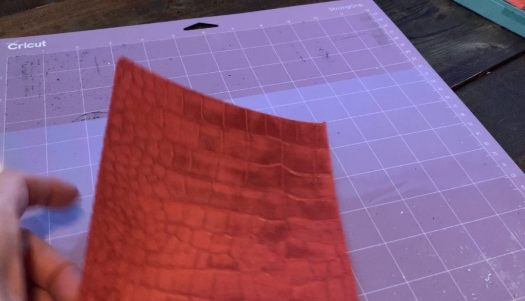 Placing leather onto the Cricut mat