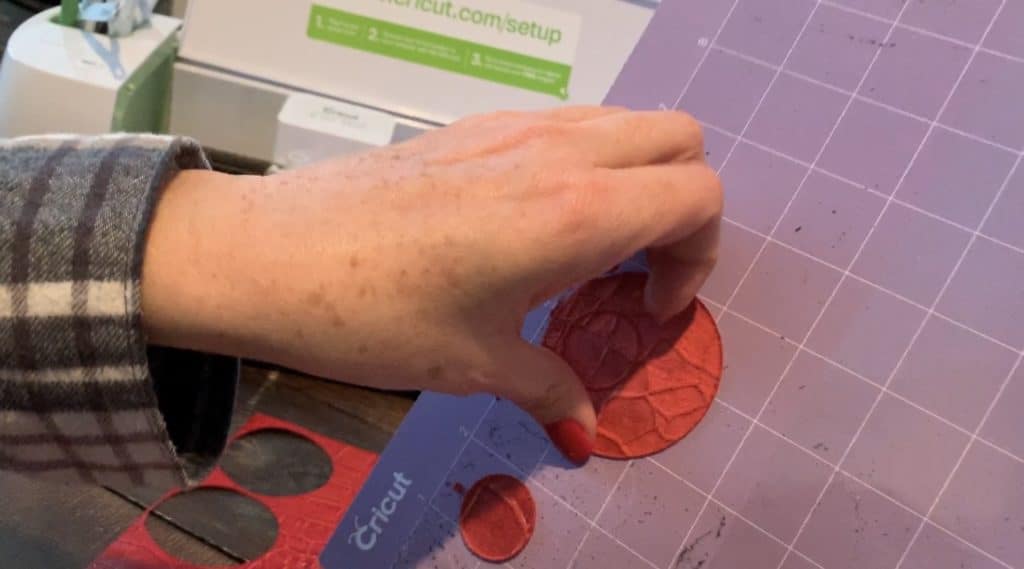 removing the leather earrings diy from the cricut mat